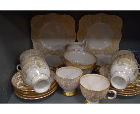 a part tea service by Tuscan china with a pink and gilt design