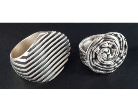 Two modernist, circular rings:, diameter of ring head ca. 2.8-3.3cm, ring size L1/2 & Q, total weight ca. 57.5gms (2).  'The 