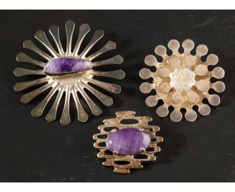 Three modernist brooches,: Jacob Hill for Buch &amp; Deichman, Denmark, a silver-plated cabochon-cut amethyst crystal brooch 