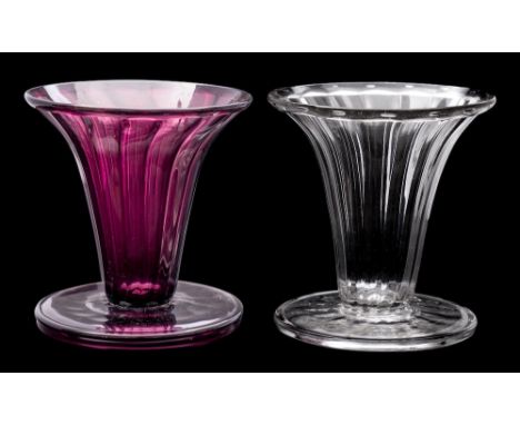 Two James Powell &amp; Sons Whitefriars glass vases: of fluted trumpet form with fold over rim and broad foot, one clear and 