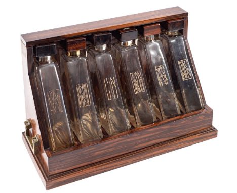 Marcel Goupy [1886-1977]. An Art Deco macassar ebony Tantalus, circa 1930:  the six glass angled decanter with macassar ebony