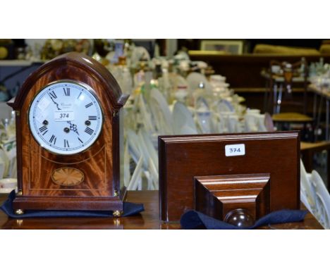 A Comitti of London mahogany bracket clock, white enamel dial, Roman numerals, twin winding holes