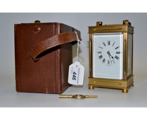 An Art Deco carriage clock, angular brass case, 8 day movement, striking on a gong, leather carry case