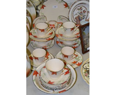 A Staffordshire Art Deco part tea service, decorated in orange , green and black