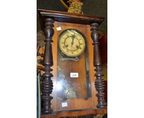 An early 20th Century walnut Vienna clock, Roman numerals, twin winding holes