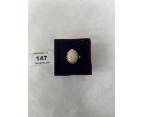 An opal ring. In gold marked 375. 2g gross. Size Q