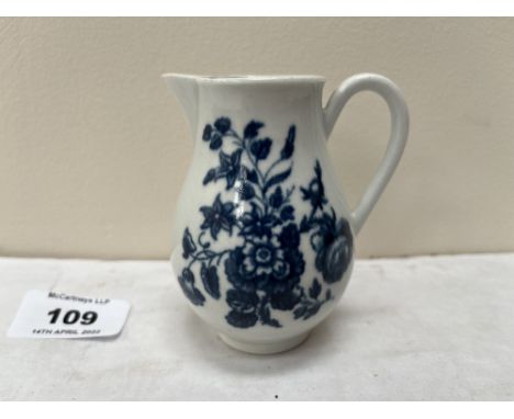 A Worcester sparrow beak jug 1770-1790, painted in blue and white with the Three Flowers pattern. Underglaze crescent. 3½' hi