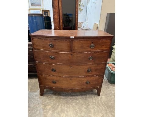 A George III mahogany bowfronted chest of two short over three long drawers on bracket feet. 41' wide 