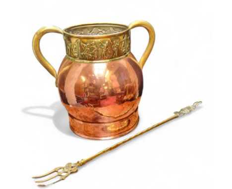 An early 20th century highly polished copper and brass twin handled jardiniere, the rim embossed in relief with classical put