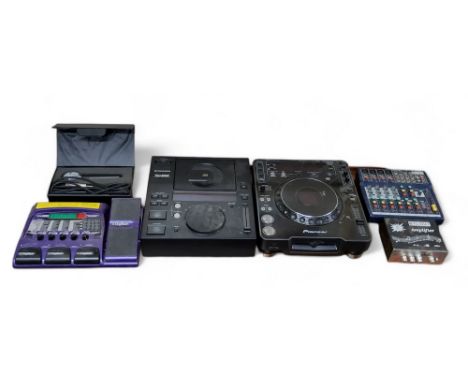A digital music mixer Pioneer CDJ-1000 MK2 digital CD deck and a Pioneer CDJ-500 II professional cd player; microphone; Digit