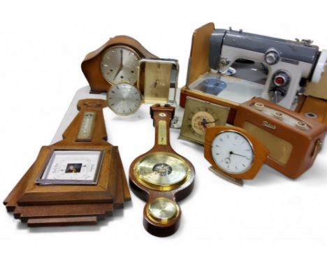 An oak Napoleon&nbsp; hat mantel clock, twin winding holes, c.1930; a mahogany wall barometer;&nbsp; President Quartz carriag