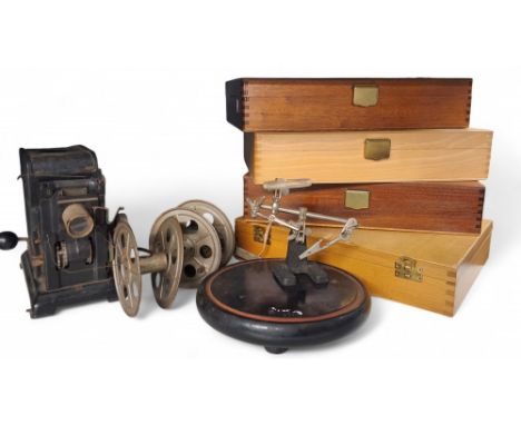 A Marklin projector, c.1940;&nbsp; &nbsp;four slide cases;&nbsp; a magnifier on stand;&nbsp; Nine coloured etchings, Scone Pa