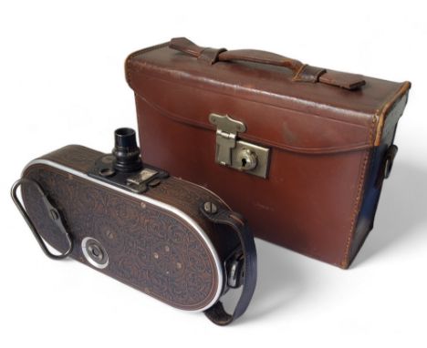 An unusual Bell &amp; Howell Company, Chicago, 'Filmo' automatic cine camera No.75, with faux leather pressed metal body, ori