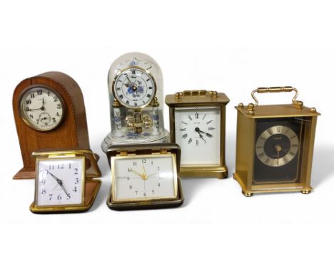 An early 20th century domed clock, 8-day movement, the case with shell patera, 15.5cm high, c.1910;&nbsp; a 20th century anni