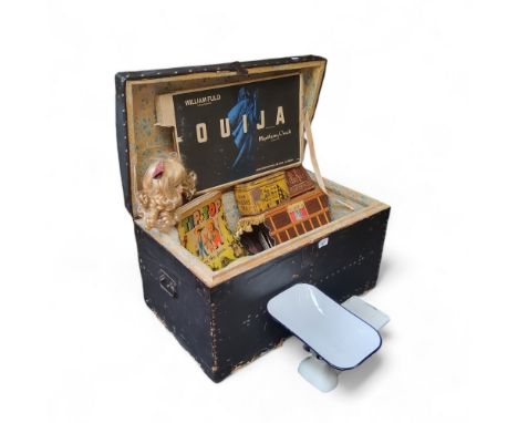 A domed topped trunk;&nbsp; a Ouija board; a cream&nbsp;telephone, model 741, GNA, 80//2;&nbsp; scales;&nbsp; weights;&nbsp; 