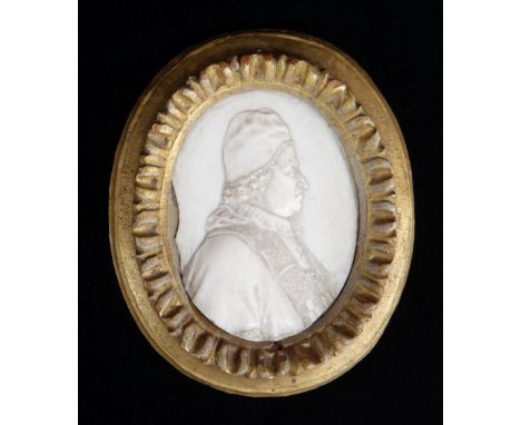 ITALIAN IVORY PORTRAIT MEDALLION OF POPE CLEMENT XI (1649-1721), 18th Century, carved in low relief facing to sinister, the o