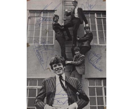HERMAN'S HERMITS: A good vintage signed 7 x 9.5 magazine photograph by all five members of the English beat rock band of the 