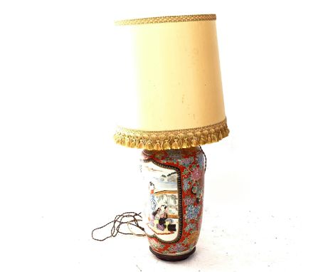 A large Chinese ceramic lamp with painted decoration, with stand and shade, height overall 90cm 