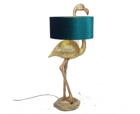 A large gilt composite floor standing flamingo lamp, with green shade, H140cm 