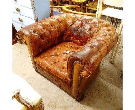 A leather Chesterfield button-back Club chair, with button seat, W100cm, H74cm, seat height 38cm and depth 60cm 