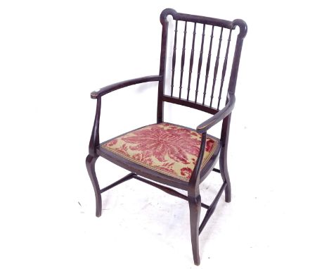 An ebonised parlour armchair, with upholstered seat and bobbin turned back 