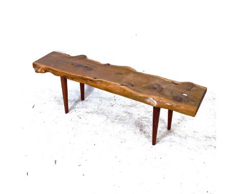 A small yew wood bench, with maker's label for Reynolds of Ludlow, L123cm, H40cm 