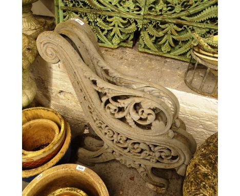A pair of scrolled cast-iron bench ends with centre leg (3) 