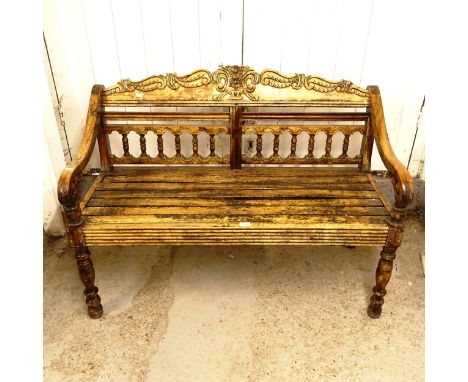 An Indian teak bench with spindle turned back, W120cm 