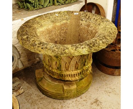A large weathered concrete basketweave planter on stand, W77cm, H53cm