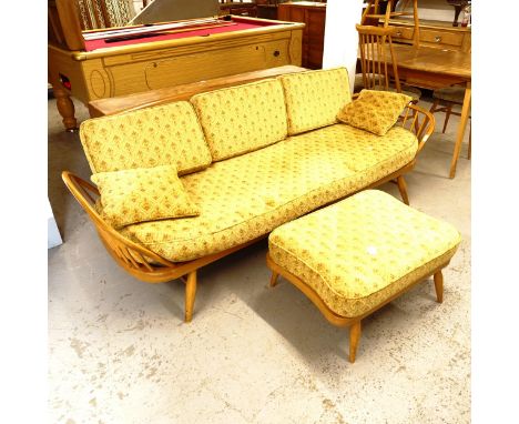 A mid-century Ercol elm and beech day bed/settee, L200cm, together with a matching footstool 