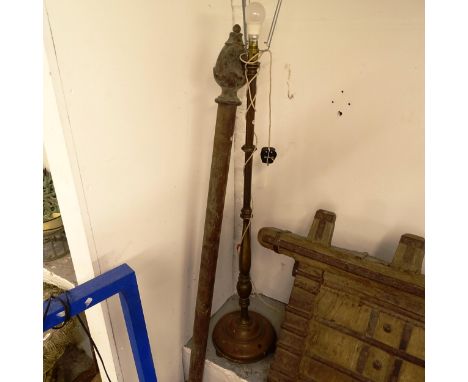 A mahogany curtain pole with carved finials, L170cm, and a brass standard lamp 