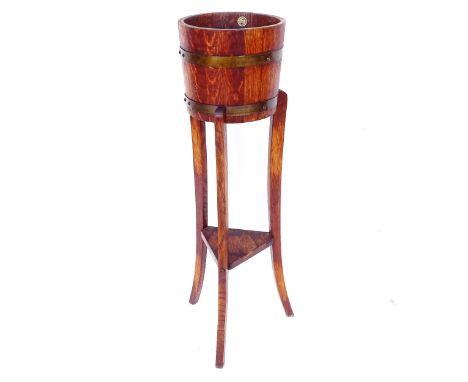 R A Lister &amp; Co Limited coopered oak jardiniere, mounted on 3 tapered legs, diameter 27cm, height 92cm 