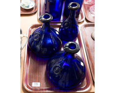 A Pair of Holmegaard Blue Glass "Viking" Decanters, by Ole Winther, each with a mask seal, 22cm high, together with a single 