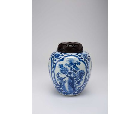 A CHINESE BLUE AND WHITE OVOID ‘ANTIQUES AND FLOWERS’ JARKANGXI 1662-1772Painted with four panels containing chrysanthemum, t
