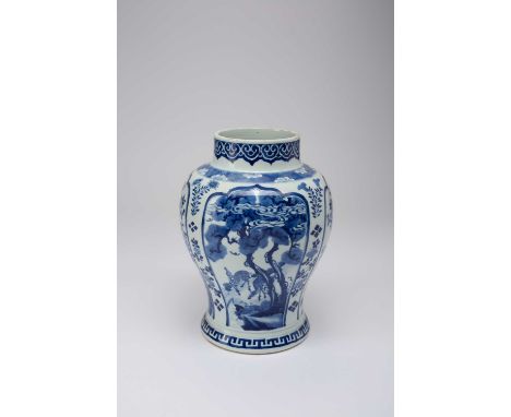 A CHINESE BLUE AND WHITE BALUSTER VASEKANGXI 1662-1722Painted with panels containing deer and cranes beneath pine trees and f