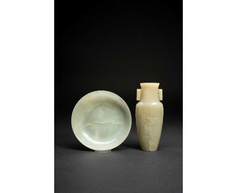 A CHINESE CELADON JADE VASE AND A JADE DISHLATE QING DYNASTYThe vase with a flattened ovoid body carved with prunus and with 