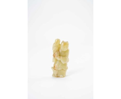 A CHINESE YELLOW JADE CARVING OF TWO BOYS17TH/18TH CENTURYThe larger standing figure carries his small companion in his right