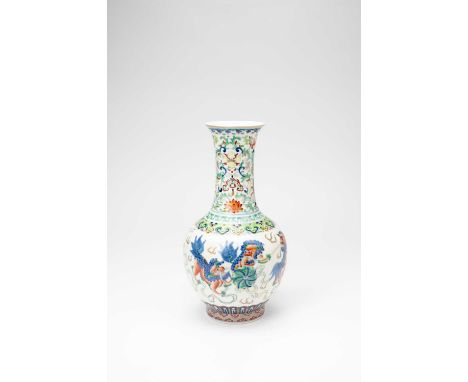 A CHINESE WUCAI 'LION DOG' BOTTLE VASE19TH/20TH CENTURYThe body painted with five Buddhist lion dogs playing with a brocade b