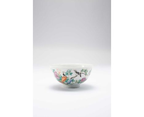 A CHINESE FAMILLE ROSE ‘BIRDS AND FLOWERS’ BOWLLATE QING DYNASTYPainted with two black and white birds amidst peony, a nine c