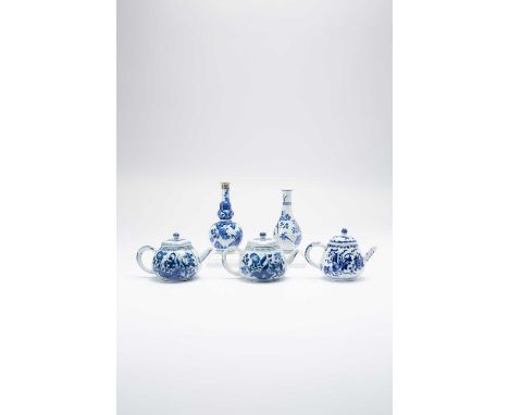 THREE CHINESE BLUE AND WHITE TEAPOTS AND TWO VASESKANGXI 1662-1772One teapot with a cover, the other two with associated cove