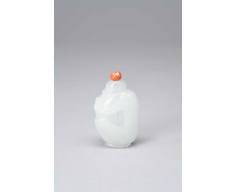 A CHINESE OPALESCENT WHITE GLASS SNUFF BOTTLE 1800-50Carved as a monkey clutching a large peach, the animal’s fur delicately 