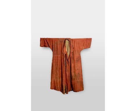 † †AN EARLY CHINESE SILK ROBETANG DYNASTYIntricately woven with roundels of studded beads into which two confronting dragons 