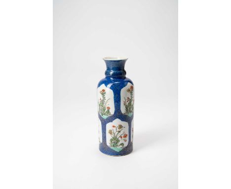 A CHINESE FAMILLE VERTE CYLINDRICAL VASEKANGXI 1662-1722Painted with eight panels containing flowers on a powder-blue ground,
