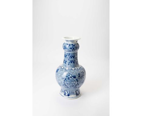 A LARGE CHINESE BLUE AND WHITE GARLIC-NECK BOTTLE VASELATE QING DYNASTYAfter a Delft shape, decorated with birds, peony and l