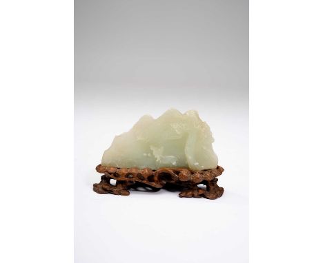 A CHINESE PALE CELADON JADE MOUNTAIN CARVINGQING DYNASTYCarved with a spotty deer beneath a pine tree beside lingzhi, togethe