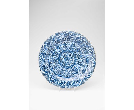 A LARGE CHINESE BLUE AND WHITE PLATEKANGXI 1662-1772Decorated with a central stylised lotus encircled by smaller panels of fl