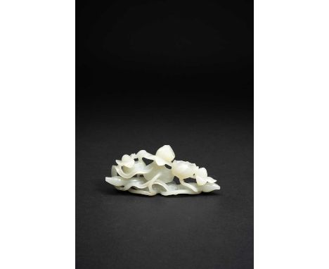 A CHINESE PALE CELADON JADE CARVING OF LOTUSQING DYNASTY OR LATERCarved with an egret hidden amidst leaves and stems of a lar