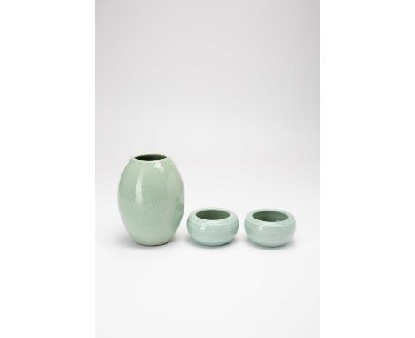 A CHINESE CELADON BARREL-SHAPED VASE AND TWO BOWLSLATE QING DYNASTYThe vase moulded with three phoenix roundels, a six charac