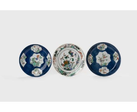 A PAIR OF CHINESE FAMILLE VERTE DISHES AND A PLATEKANGXI 1662-1722The dishes painted with panels of flowers on a powder-blue 