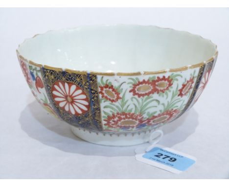 A Worcester soft paste porcelain bowl, richly decorated in blue scale kakiemon style and gilded. Fretted square mark in under